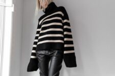a cozy winter or fall look with an oversized black Breton stripe sweater, black leather pants, black Chelsea boots and a bag