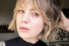 a delicate jaw-length bob with blonde balayage and wispy bangs plus a bit of waves is a relaxed and cool idea