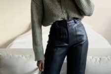 a green cardigan tucked into black leather flare pants are a lovely and cozy combo for working