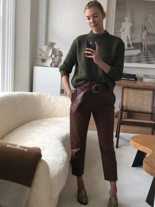 a green chunky knit sweater, brown cropped leather pants, snakeskin print shoes are a lovely work look