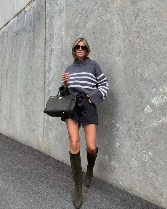 a grey Breton sweater, black denim shorts, dark green knee boots and a black bag for the fall