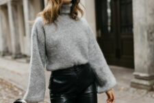 a grey oversized sweater, black leather pants and a black mini bag are amazing for winter