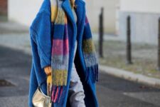 a grey sweatshirt and sweatpants, white trainers, a blue faux fur coat and a colorful scarf are great for a bold winter look
