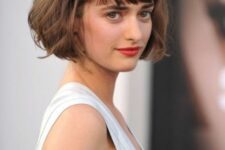 a lovely ear-length brunette bob with a classic fringe, waves and curved ends screams Parisian chic