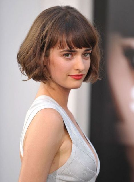 a lovely ear-length brunette bob with a classic fringe, waves and curved ends screams Parisian chic