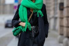 a refined winter outfit with a black blazer mini dress, a chain belt, a black coat, a bold green scard and a bag on chain