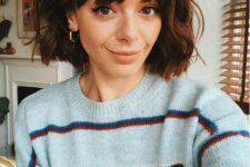 a short brunette bob with waves and bangs is a lovely and very girlish idea for any time