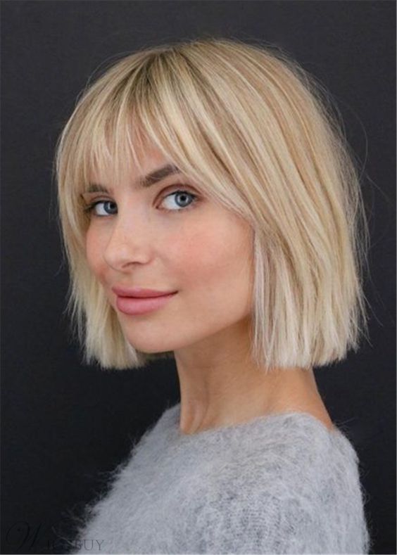 a short messy blonde bob with wispy bangs is a very lightweight and airy idea to try