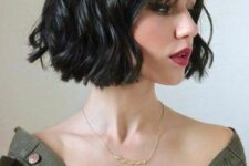 a short wavy black bob with a bit of wispy bangs is a very refined and bold idea to rock