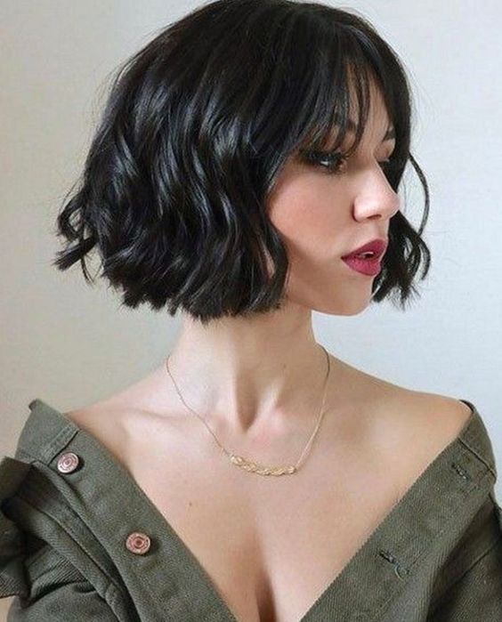 a short wavy black bob with a bit of wispy bangs is a very refined and bold idea to rock