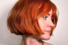 a stunning jaw-length bob with wispy bangs is a gorgeous idea to make a statement with color and shape