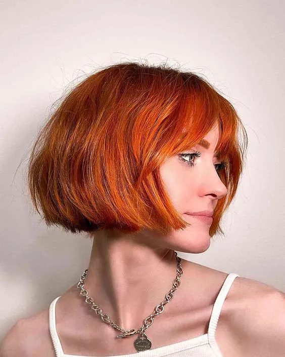 A stunning jaw length bob with wispy bangs is a gorgeous idea to make a statement with color and shape
