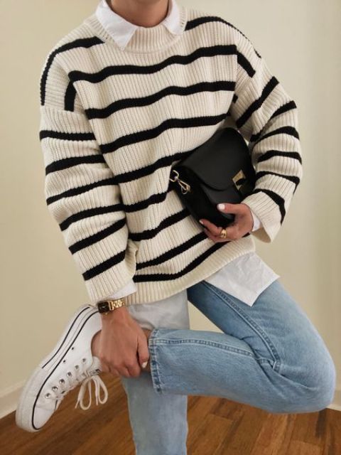 a white shirt, a Breton striped sweater, blue jeans, white sneakers and a black bag are a great combo for the fall