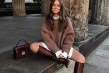 a white shirtdress, a brown jumper over it, brown knee boots and a matching bag for a lovely look