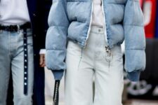 a white top, bleached wide-leg jeans, white trainers, a light blue cropped puffer and a black bag for a lovely winter look