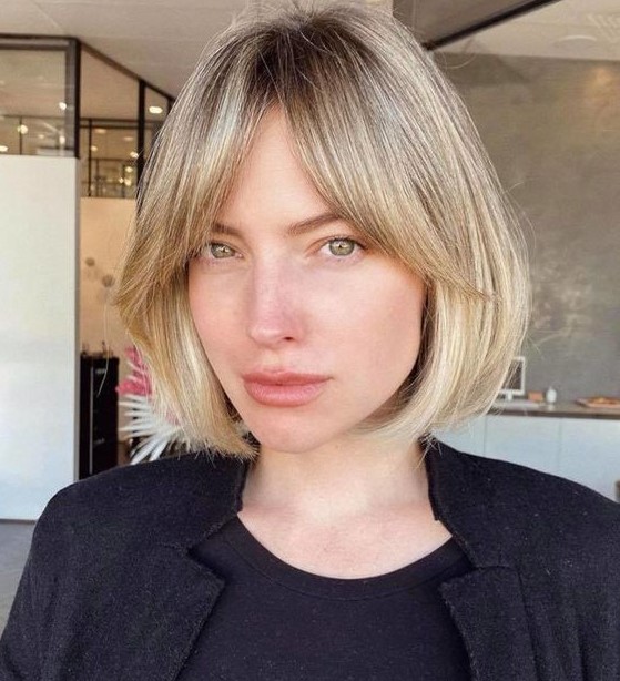 an elegant blonde short bob with curtain bangs is a lovely and chic idea to rock anytime