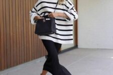 an oversized Breton stripe sweater, a black maxi skirt, brown loafers and a black bag for a chic office look