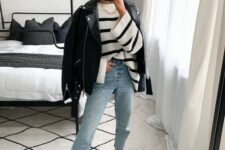 light blue jeans, a Breton stripe sweater, a black leather jacket and black sneakers for the fall or winter