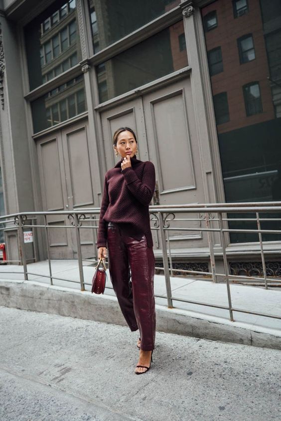 a beautiful purple outfit with a sweater, croco leather pants, black minimalist shoes and a red bag for the fall