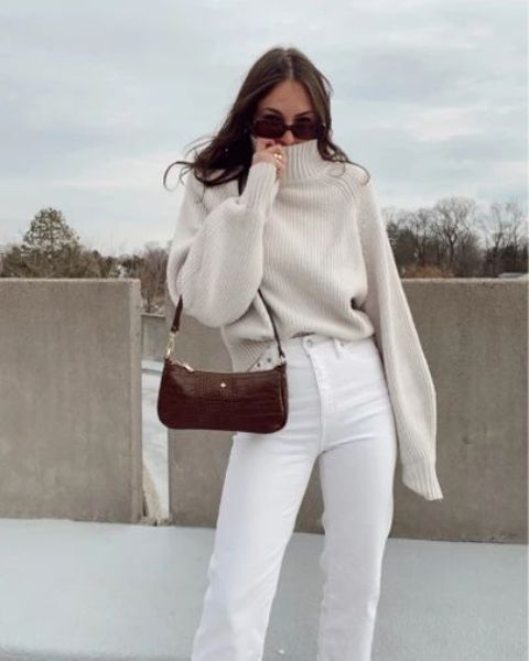 a cool winter outfit with a neutral sweater, white jeans, a burgundy mini bag is amazing