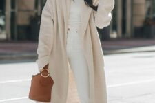04 a total white look with a turtleneck, jeans, blush shoes, a neutral faux fur coat, a camel bucket bag