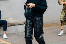 05 a black sweatshirt, black croco leather pants, white strappy heels, a chain necklace and a black bag