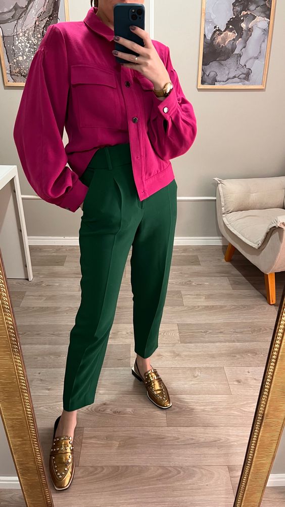 a jewel tone outfit with a magenta shirt, green high waisted pants, gold shoes is a bold idea for the fall
