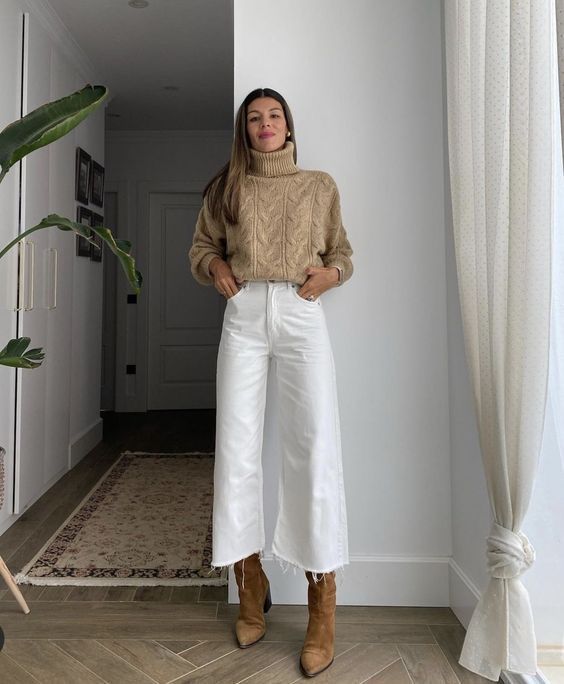 a beige turtleneck sweater, white flare jeans, brown boots   add a coat and a winter look is ready