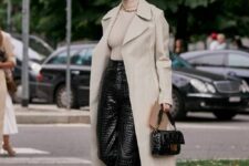 07 a stylish office look with a neutral turtleneck, black croco leather pants, nude heels, a neutral trench and a black bag