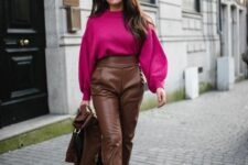 07 a stylish winter outfit with a magenta sweater, brown high waisted leather pants and a jacket, brown shoes and a bag