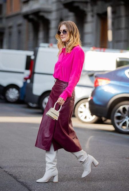 a magenta blouse, a burgundy leather midi skirt, white boots and a mini bag are a beautiful combo for work