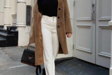 17 a simple and stylish winter outfit with a black turtleneck, white jeans, black boots and a bag plus a brown faux fur coat