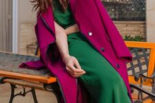 20 a green slip midi dress paired with a magenta coat creates a fantastic and bold jewel tone fall look