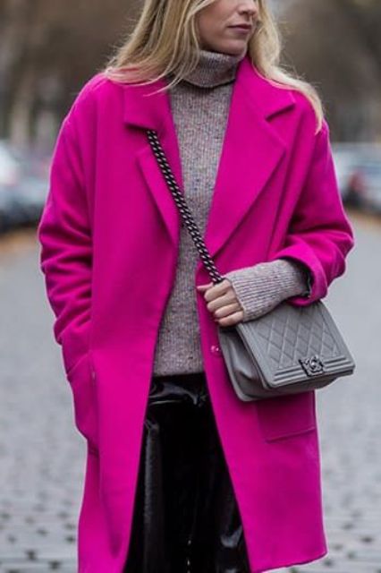a grey turtleneck, black leather pants, a magenta coat and a grey bag are a lovely and bold look for winter