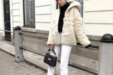 22 a black turtleneck, white jeans, black boots, a neutral faux fur coat, a black bag are lovely for winter