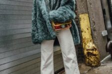 23 a cool winter outfit with a green shirt and a matching faux fur jacket, white jeans, nude boots and a colorful bag