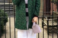 24 a creative outfit with a purple and white striped sweater, white wideleg jeans, tan boots, a green coat and a lilac bag