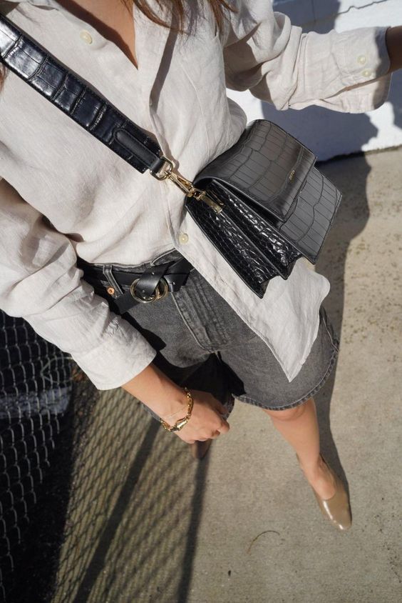 an off-white linen shirt, a grey denim knee skirt, a black belt, nude shoes and a black croco leather bag