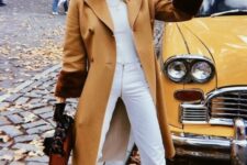 29 a white turtleneck, jeans, knee boots, a beige coat and an amber bag are a lovely fall or winter combo