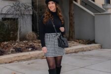 With black beret, black leather crossbody bag, black tights and black high boots