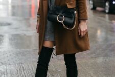 With black leather and suede bag and brown mini coat