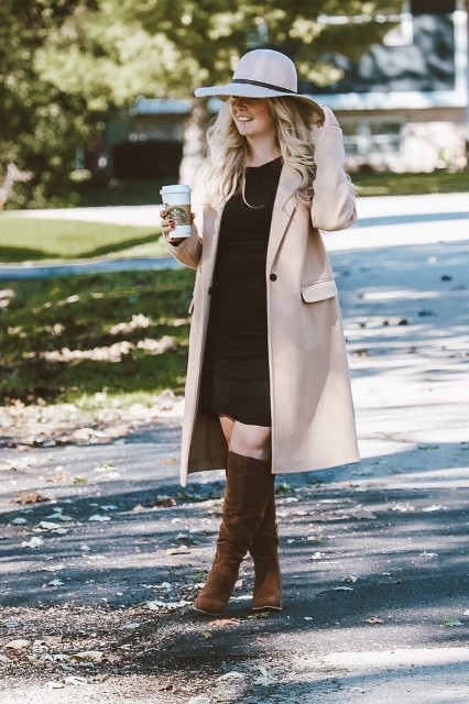 With black mini dress and brown suede high boots