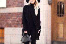 With black turtleneck, black pants, black suede over the knee boots and black leather mini bag
