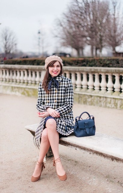 With blue skirt, polka dot scarf, blue leather bag and brown suede lace up flat shoes