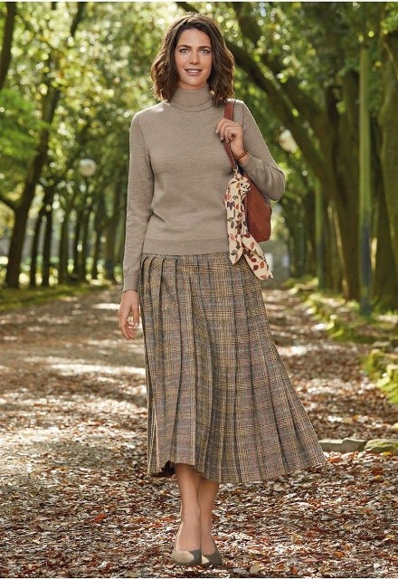 With brown leather bag, printed scarf and beige suede shoes
