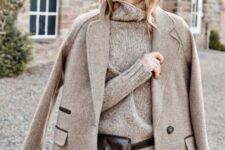 With gray loose turtleneck sweater, dark brown leather waist bag and checked tweed skirt