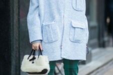With light blue turtleneck, green checked cropped pants, black suede heeled boots and white and black faux fur bag