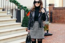With oversized sunglasses, black leather jacket, black tights, black suede over the knee boots and black leather bag