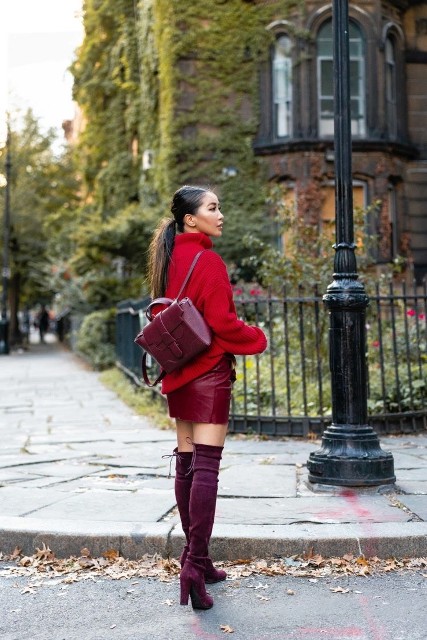 With red loose turtleneck sweater and marsala leather backpack