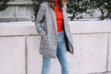 With red turtleneck, golden rounded earrings, light blue cuffed jeans and black high heeled boots